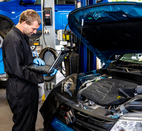 A technician performs a car service