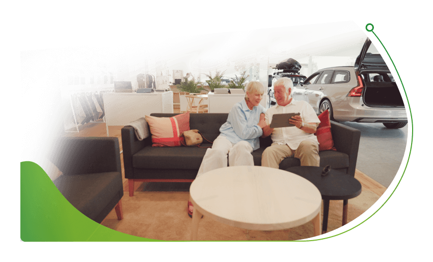 A couple look at car; New car deals on 0% finance image