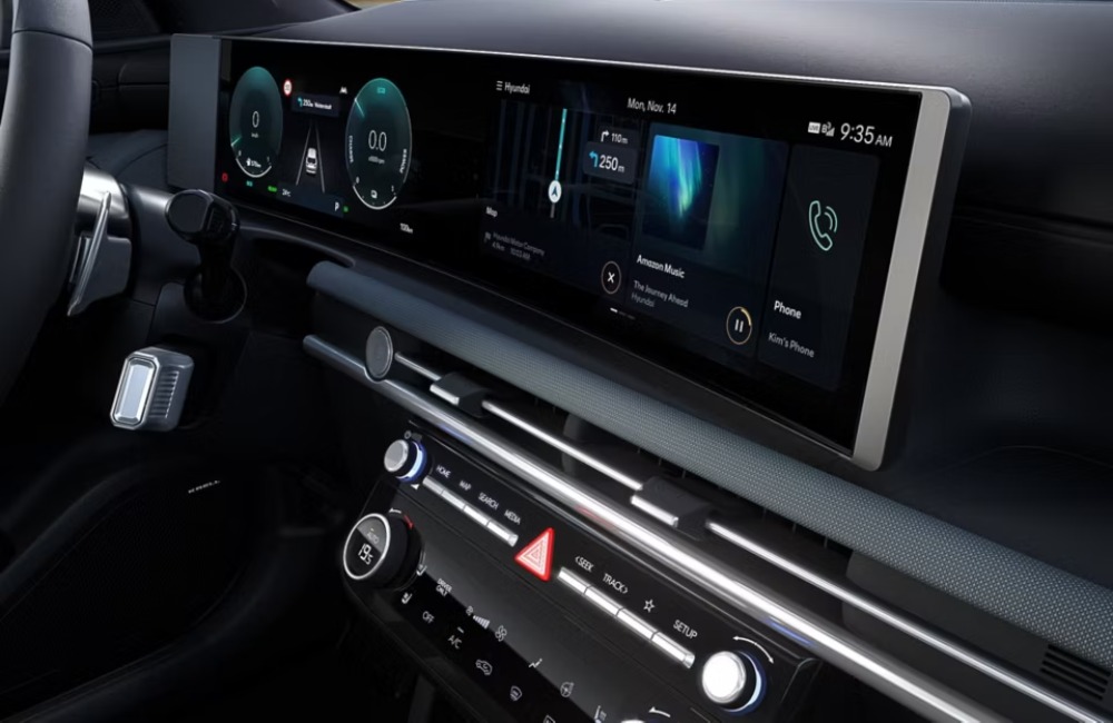 Close up shot of the interior infotainment system a new Hyundai TUCSON Hybrid, with a focus on the screen and interface.