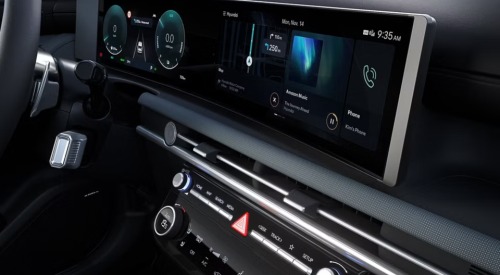 Close up shot of the interior infotainment system a new Hyundai TUCSON Hybrid, with a focus on the screen and interface.