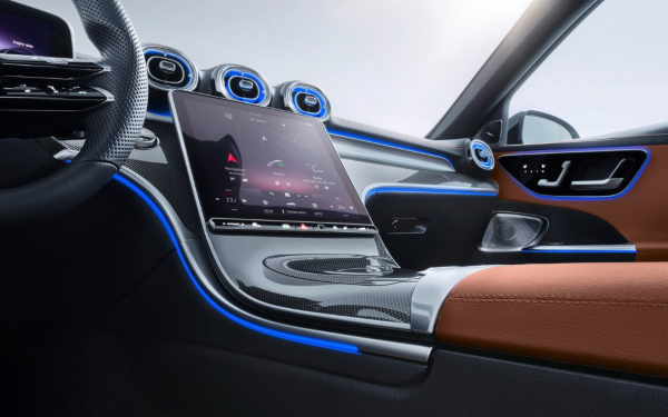 Used Mercedes-Benz C-Class interior with steering wheel and centre touchscreen.