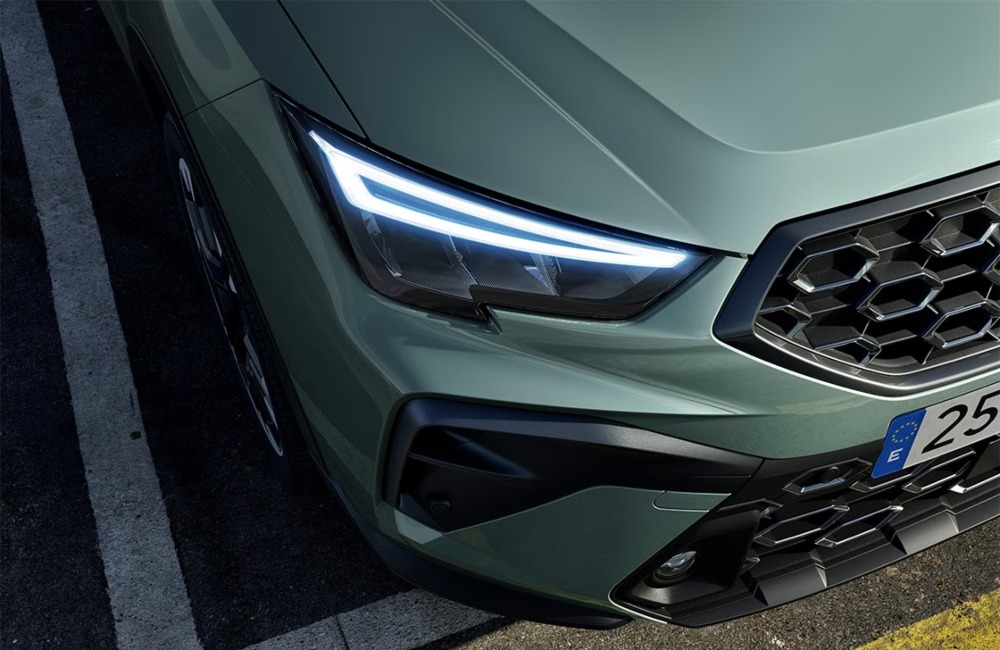 Close up angled front shot of a new SEAT Arona and its LED lighting.