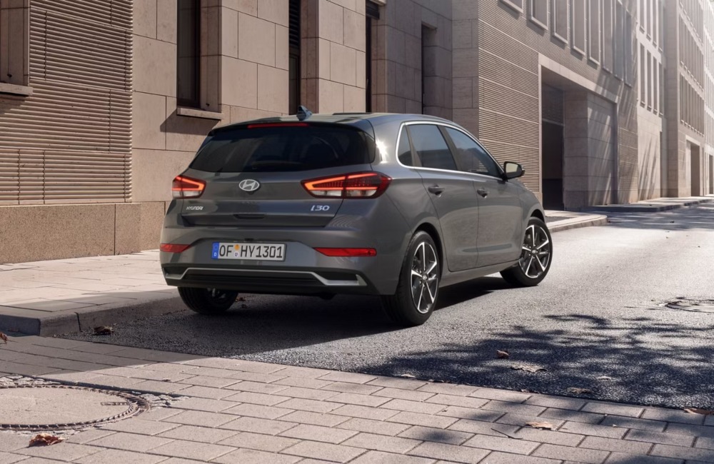 Rear view of a new Hyundai i30 car, parked on a city street.