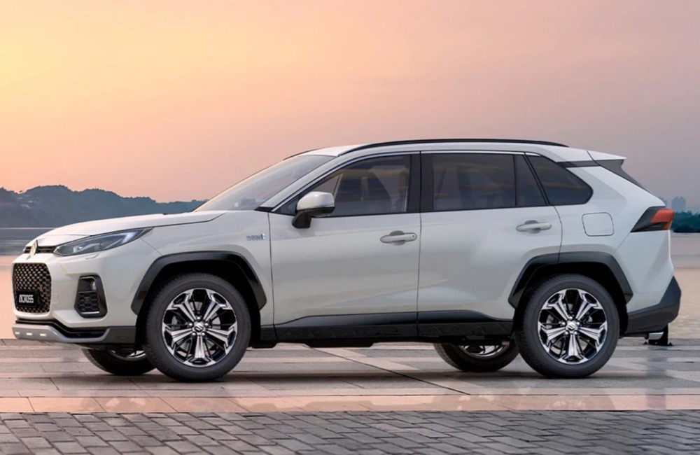 Angled side view of a new Suzuki Acorss in white, showing off the unique styling and alloy wheels.