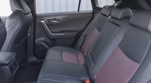 Interior shot of a Suzuki Across, showing off the comfortable and stylish rear seating.