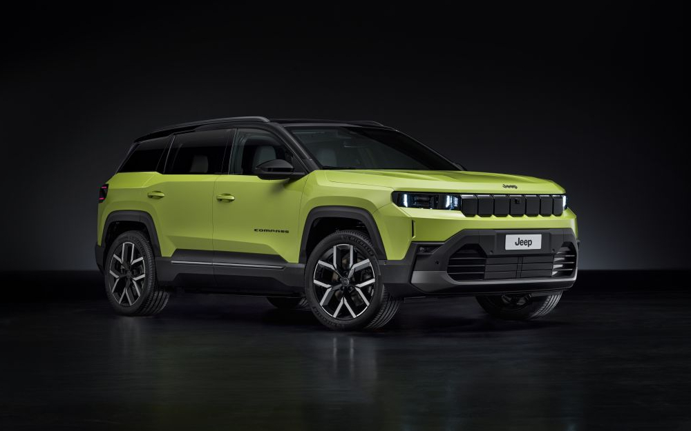 New Jeep Compass e-Hybrid in Hawaii Green on a black background.