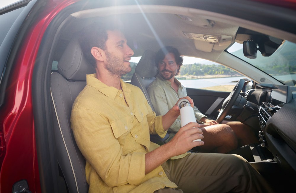 Two people sat in the front two seats of a new Citroen C4.