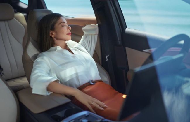 Woman relaxing in new BYD car
