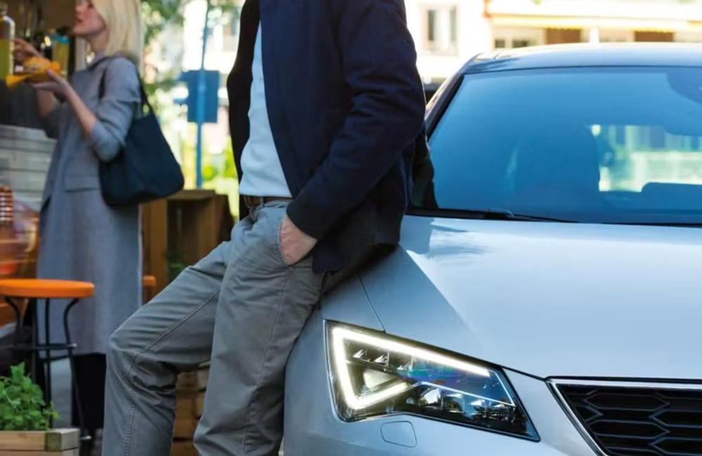 Person leaning on a seat car, showing off the unique LED lighting.