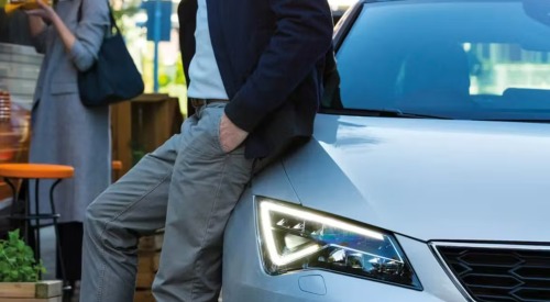 Person leaning on a seat car, showing off the unique LED lighting.