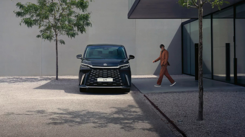 New Lexus LM 350h with a passenger walking by