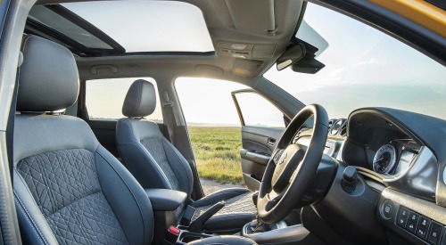 Interior shot of a used Suzuki Vitara showing off the drivers position and comfortable seating.