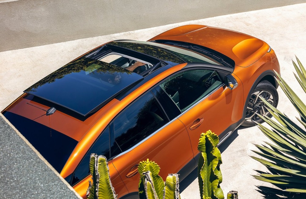 Angled top down view of a Citroen C4, showing off an open sunroof.