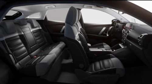 Interior side shot of a Citroen C4 showing off the comfortable seating, driving position, and stylish design.
