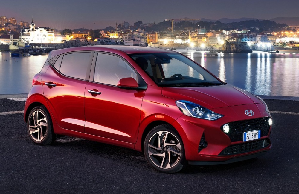 Angled side view of a used Hyundai i10, showing off the LED lighting, ally wheels, and unique design.