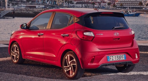 Rear angled shot of a used Hyundai i10, showing off the tailgate, compact dimensions, and alloy wheels.