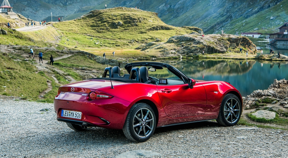 New Mazda Car MX-5 overlooking the water with fields of scenery