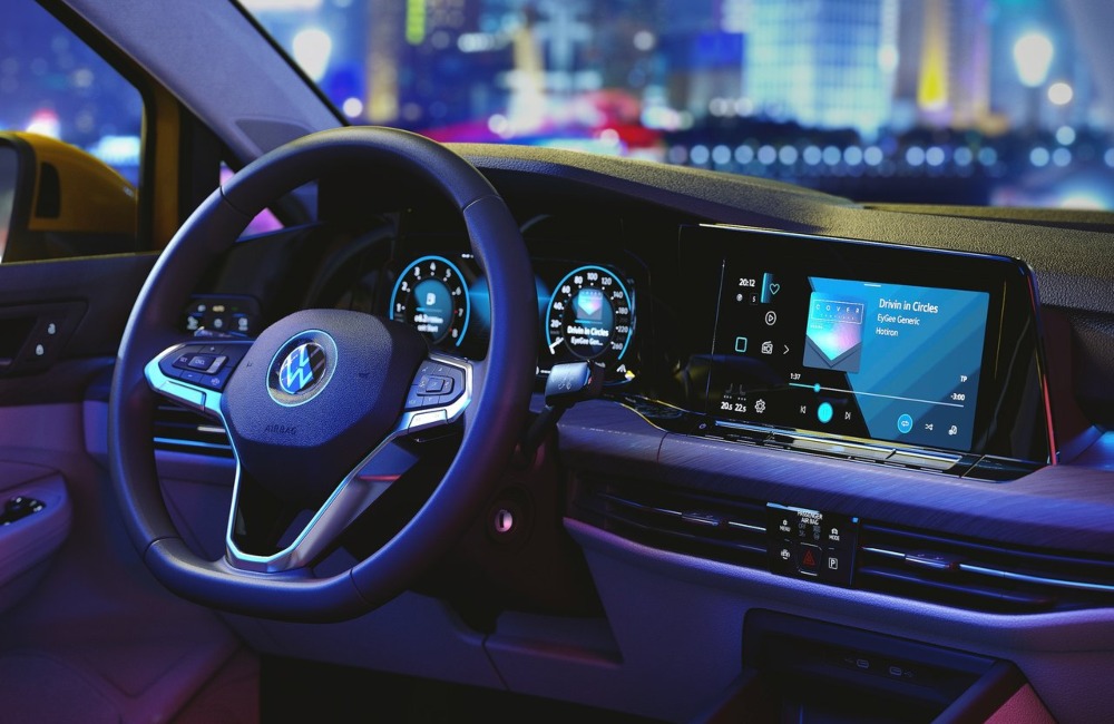Interior shot of a used VW Golf, showing off the infotainment system and driver position.