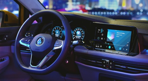 Interior shot of a used VW Golf, showing off the infotainment system and driver position.