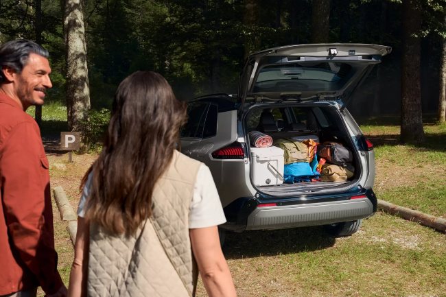 New Toyota RAV4 For Sale driving along scenic mountain view