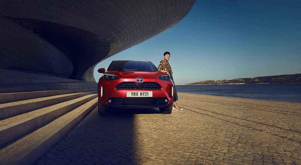 Used Toyota Yaris next to person