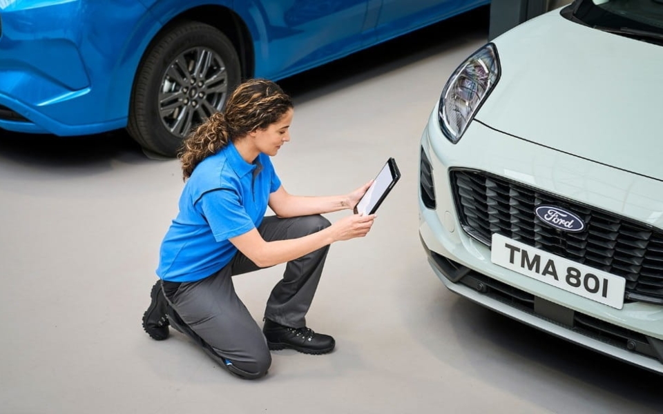 Ford Service and MOT - Technician Inspecting Brakes