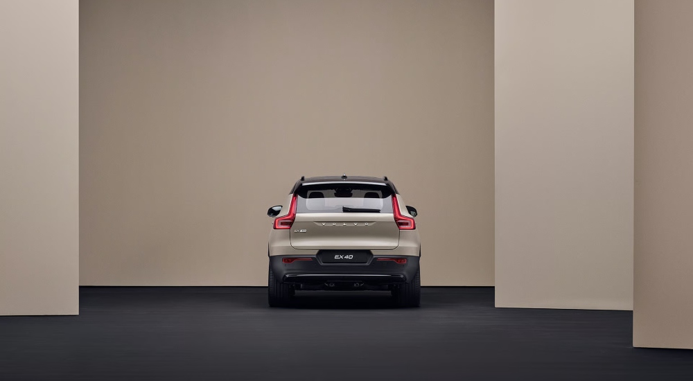 New Volvo EX40 rear in the colour Sand Dune; New Volvo EX40 range