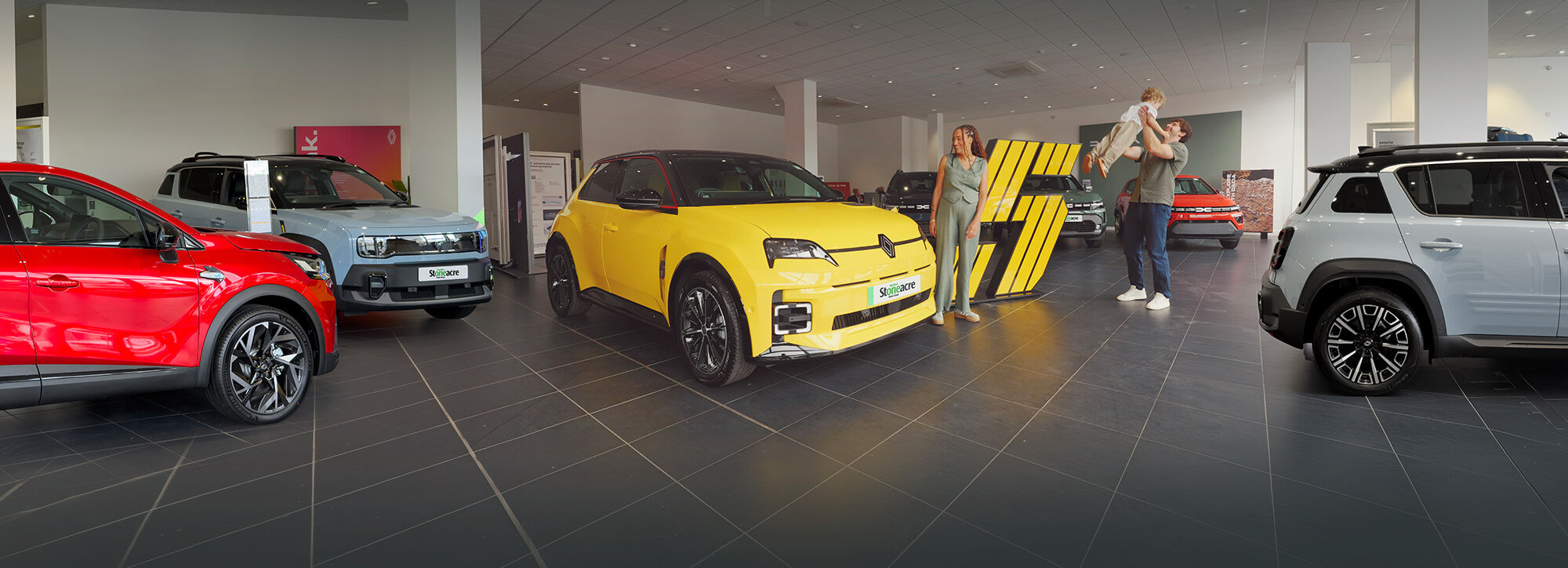 Stoneacre homepage banner featuing cars in a showroom from Renault and Dacia