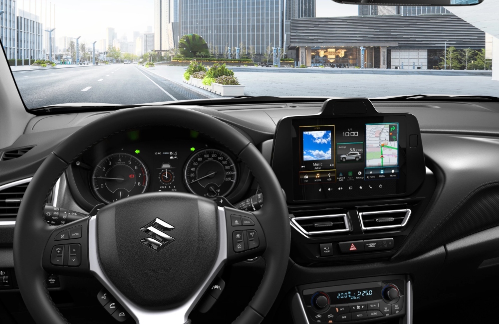 Interior shot of a new Suzuki S-Cross from the drivers perspective, showing off the steering wheel and infotainment system.