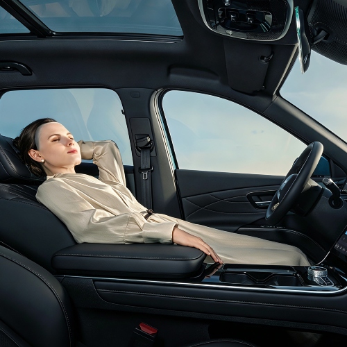 A person relaxing in the luxurious seats in a LEPAS L8; New LEPAS L8 seats