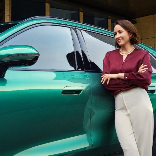 A person leaning on a LEPAS L8 in Expressive Emerald; New LEPAS L8 parking
