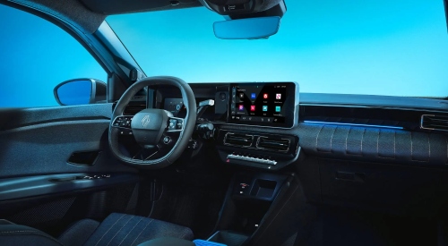 Interior shot of a new Renault 4 Plein Sud, showing off the driving position and infotainment system.