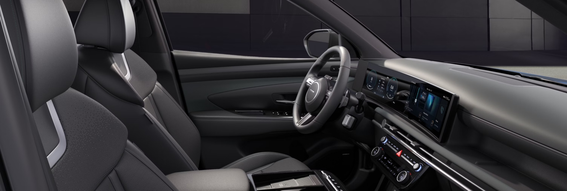 Interior shot of the front cabin of a new Hyundai TUCSON, showing off the drivers position, comfortable seating, and infotainment system