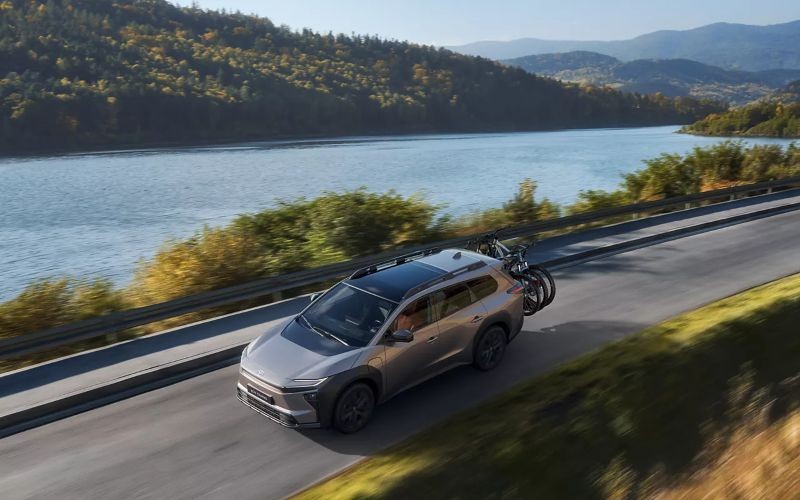 new Toyota BZ4X Touring driving down scenic road