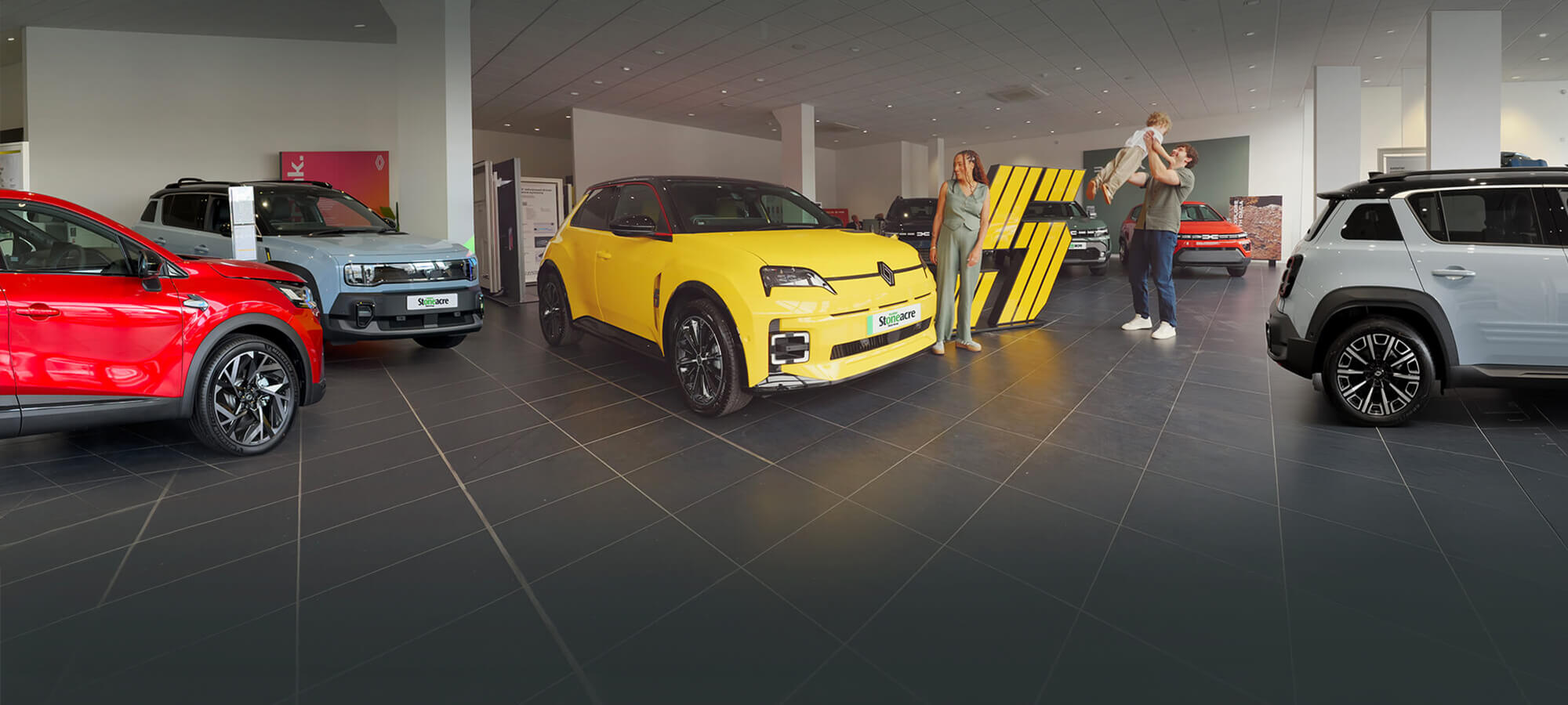 Stoneacre homepage banner featuring cars in a showroom from Renault and Dacia