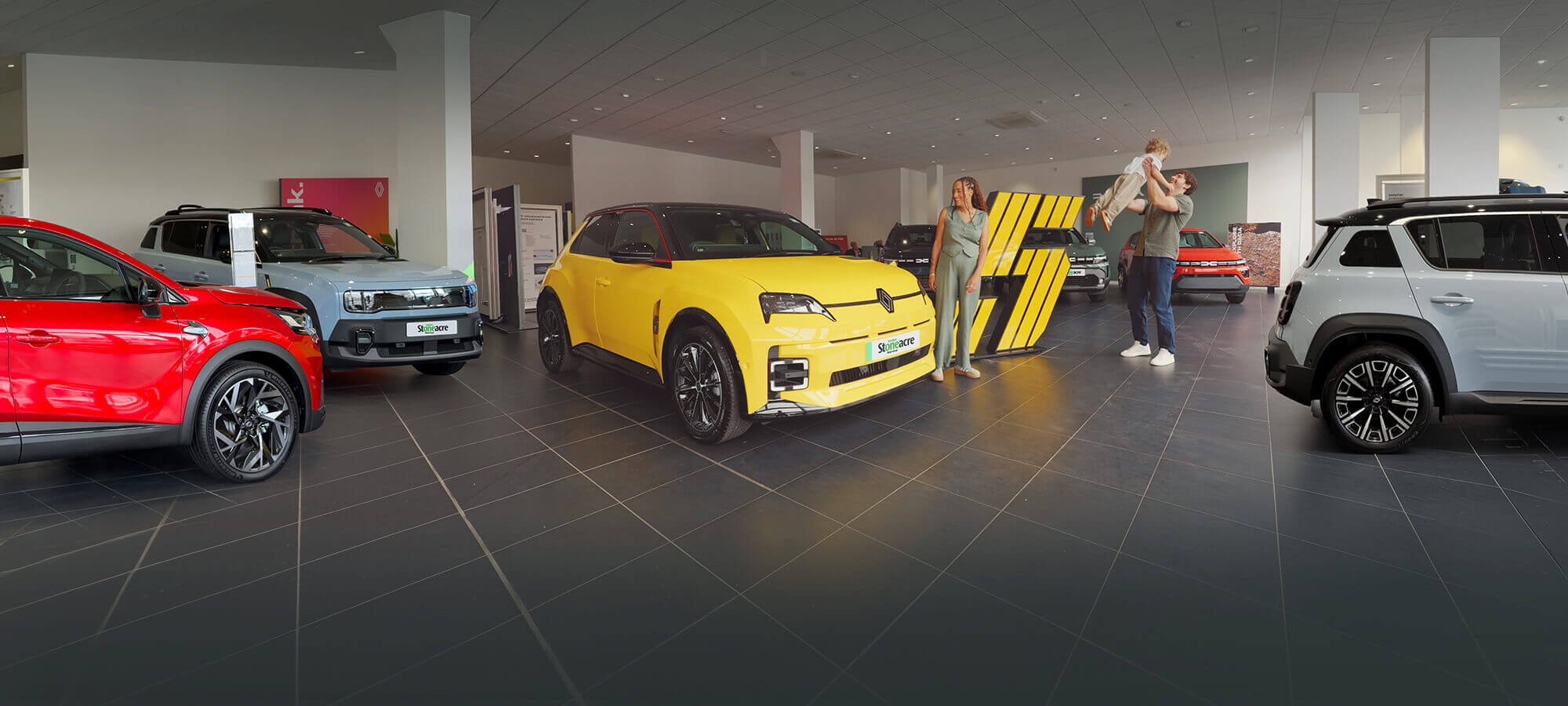 Stoneacre homepage banner featuring cars in a showroom from Renault and Dacia