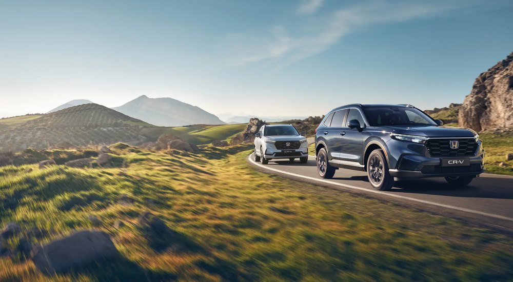 new honda cr-v plug-in hybrid driving on scenic road
