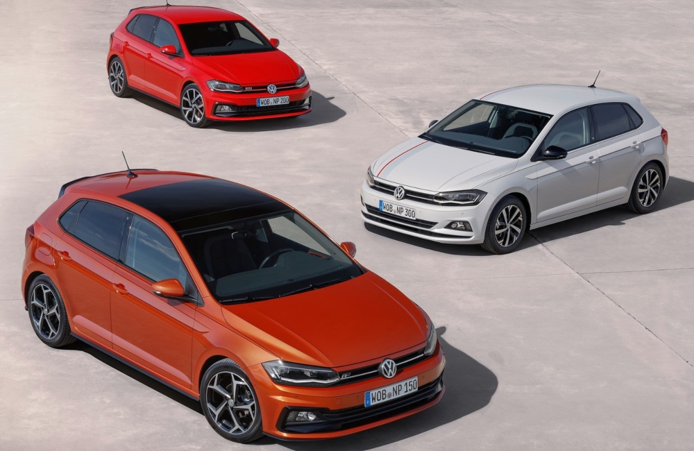 Three used VW Hatchback cars parked at an angle next to one another.