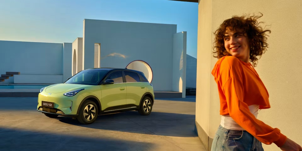 Aurora Green Geely EX2 parked up with a person walking away; New Geely EX2 Range