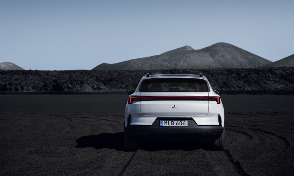New Polestar 4 SUV in a rocky landscape, rear view