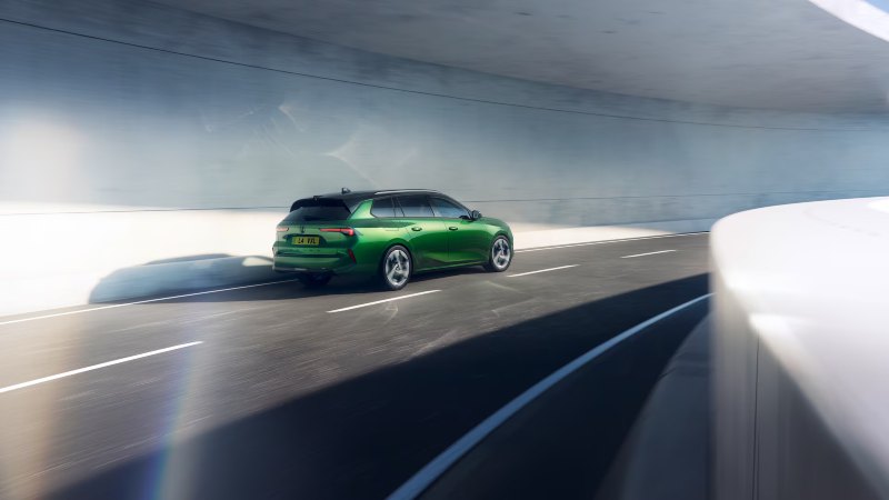 The new Vauxhall Astra Sports Tourer Electric in distance on road