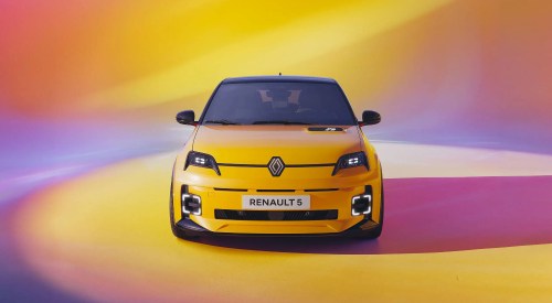 Front facing shot of a yellow new Renault 5 from a photoshoot.