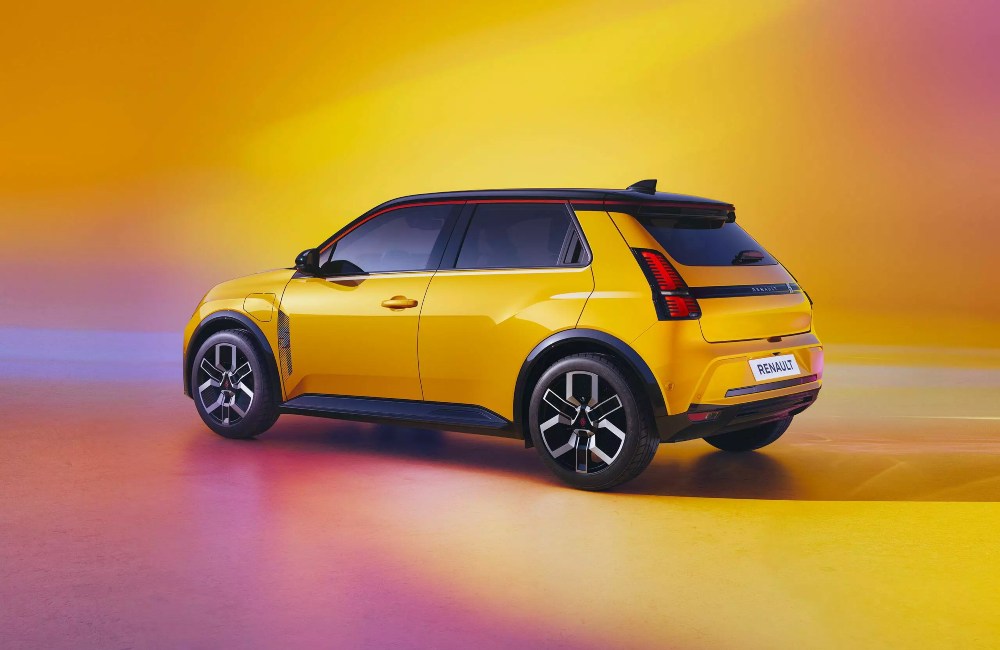 Angled rear shot of a yellow Renault 5, posing for a photoshoot.