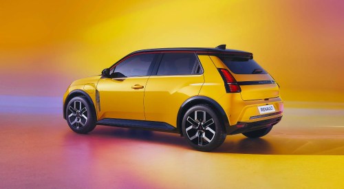 Angled rear shot of a yellow Renault 5, posing for a photoshoot.