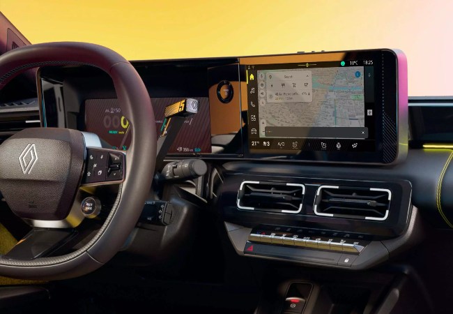 Close up shot of the Renault 5 infotainment and driver display system.
