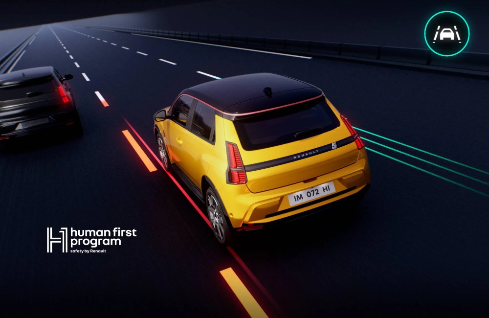 A yellow Renault 5 car driving down a simulated motorway, showing off the integrated safety systems. There is text reading "human first program",.