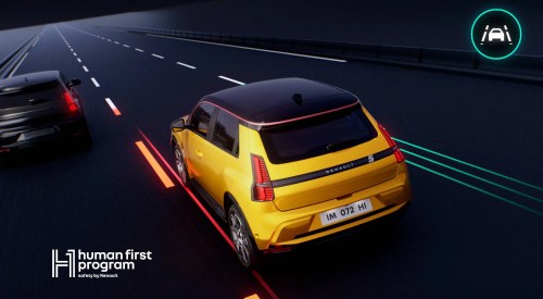 A yellow Renault 5 car driving down a simulated motorway, showing off the integrated safety systems. There is text reading "human first program",.
