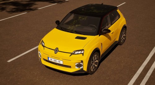 Angled top down shot of a yellow Renault 5 driving at speed down a city street.