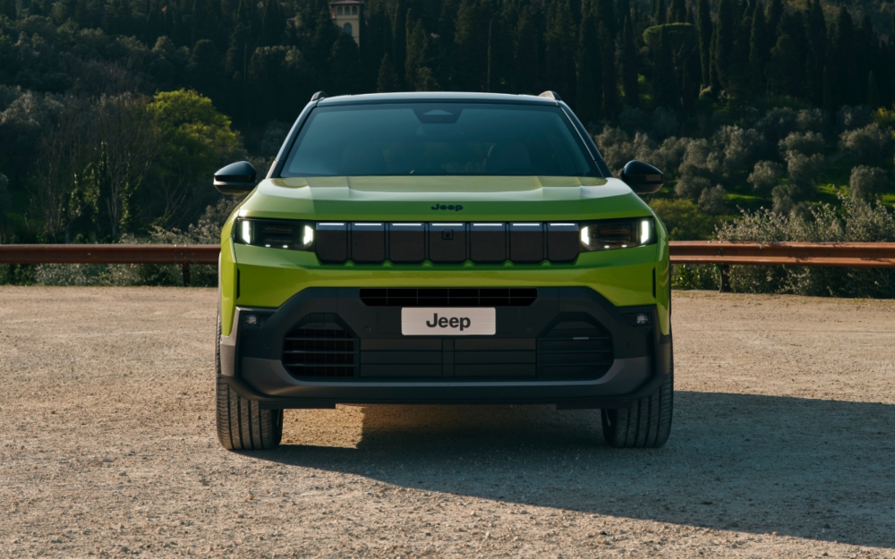 Jeep Compass in Hawaii paint in a wooded setting