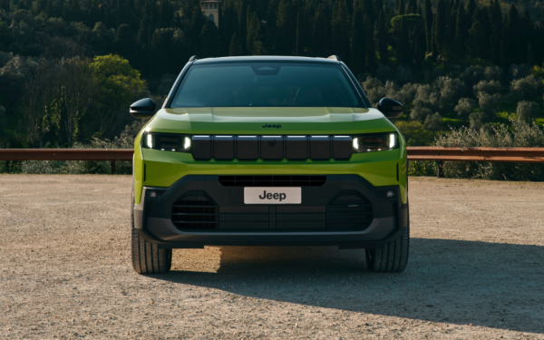 Jeep Compass in Hawaii paint in a wooded setting